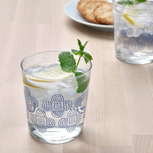 A set of four patterned glass tumblers, adding a pop of color to any table setting.