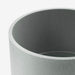 A round, grey plant pot with a wide opening and a smooth surface.