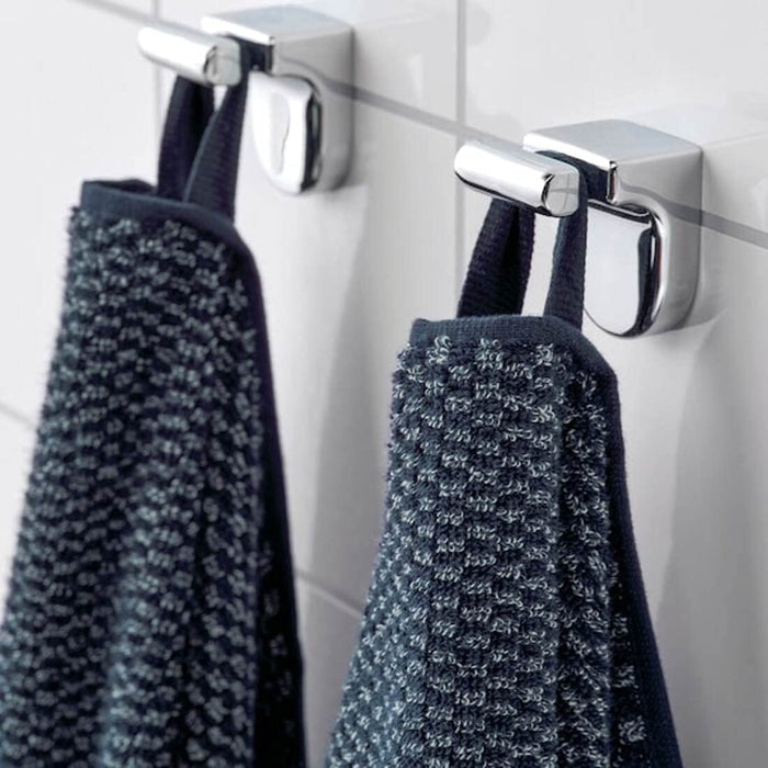 A soft and absorbent bath towel in a dark blue/mélange color, sized at 70x140 cm.