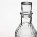 An affordable and stylish clear glass carafe with stopper from IKEA, perfect for everyday use in the home.