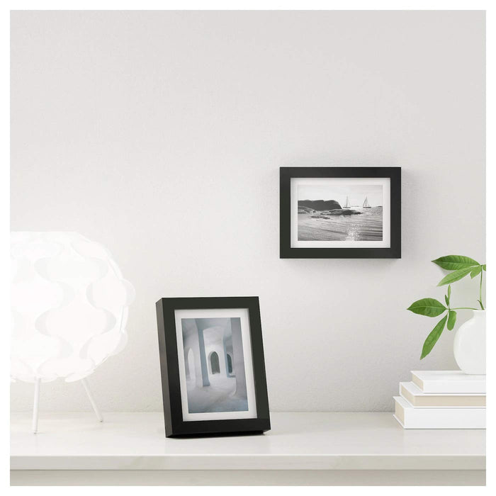 A simple and understated photo frame with a natural wood finish, perfect for a more minimalist look 90378446