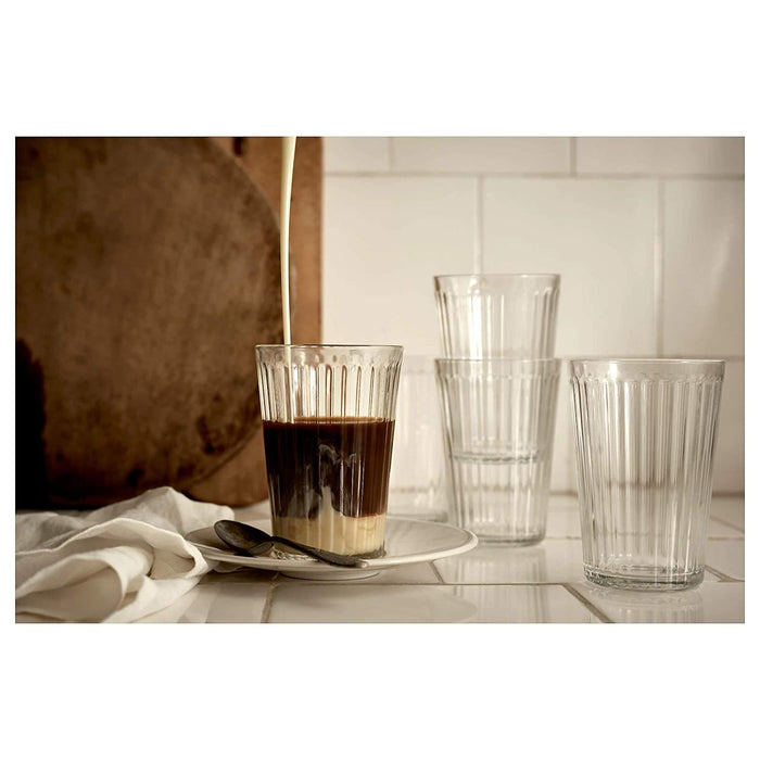 A set of clear glass tumblers with a simple, elegant design, ideal for any beverage.