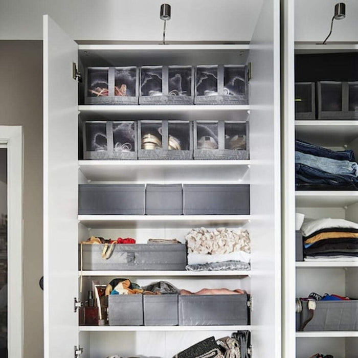 A transparent shoe box with handles from Ikea, perfect for storing and transporting your shoes.300472981