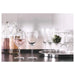 A clear glass wine glass from IKEA, with a timeless and classic design.