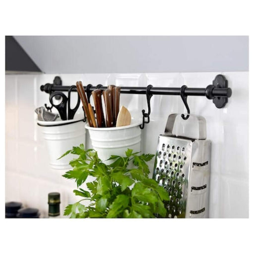 A wall-mounted Ikea rail system for organizing items in a home 70201905