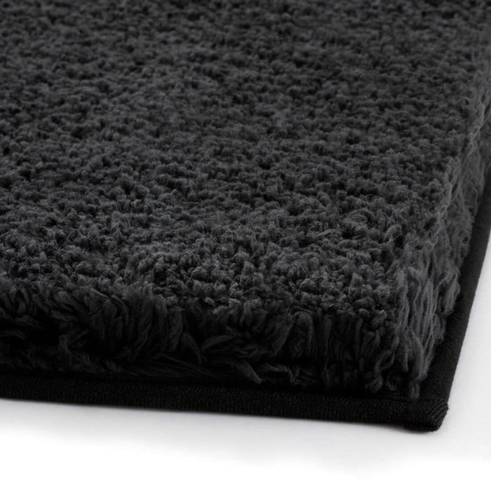 Thick and luxurious dark grey bath mat from IKEA, with a plush texture that provides comfort and warmth to your feet after a shower or bath 80489421