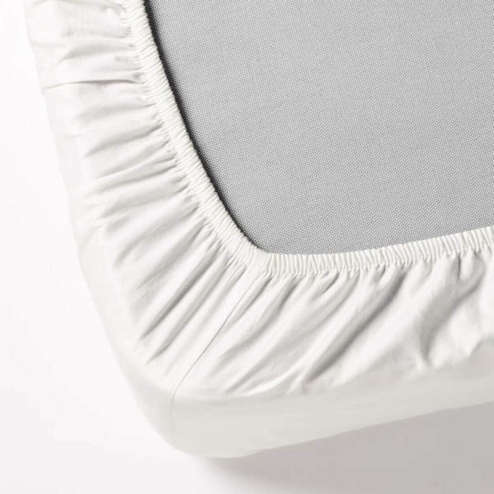 A closeup image of IKEA sheet fits over the corners of your mattress and stays in place thanks to the elastic edging -40360533