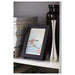 A modern black photo frame with a minimalist design, ideal for showcasing your art or photography 90378446