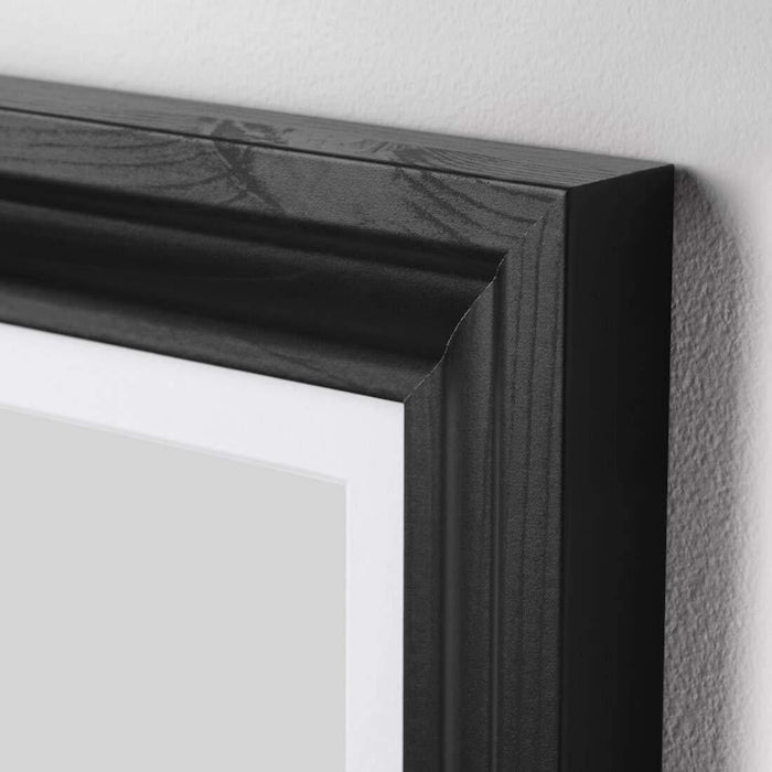 The glass-covered black stained frame by IKEA EDSBRUK protects your art from damage 40427618