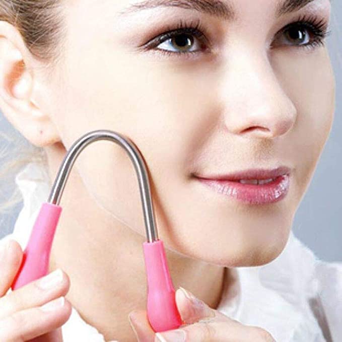Facial hair removal tool in pink color, designed for painless and gentle hair removal from the face.