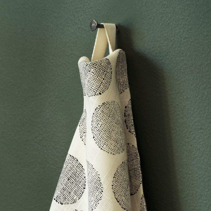 A plain cotton tea towel with a small tag in one corner 70472280