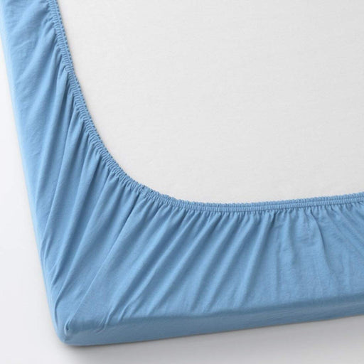 A close-up of an IKEA fitted sheet's elastic edges, showing its stretchiness and durability  70427103