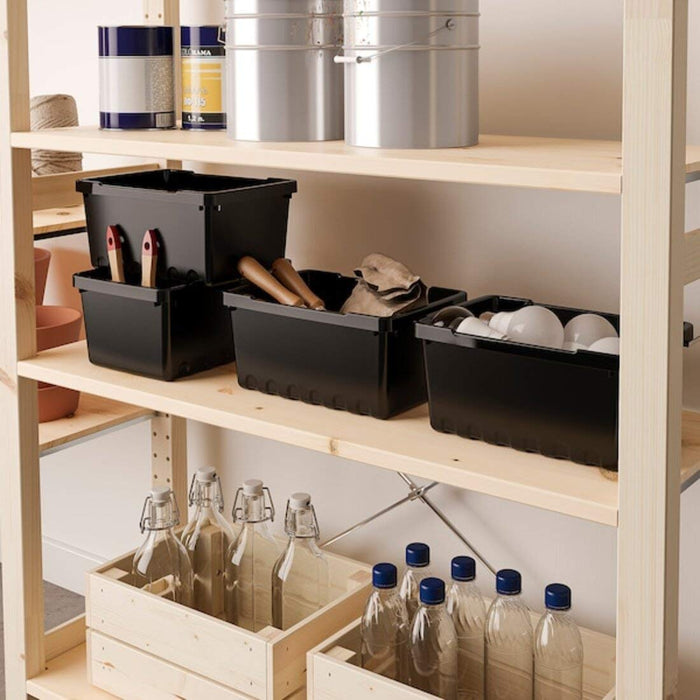 An IKEA storage box with a clear body and a snap-on lid for maximizing storage space.