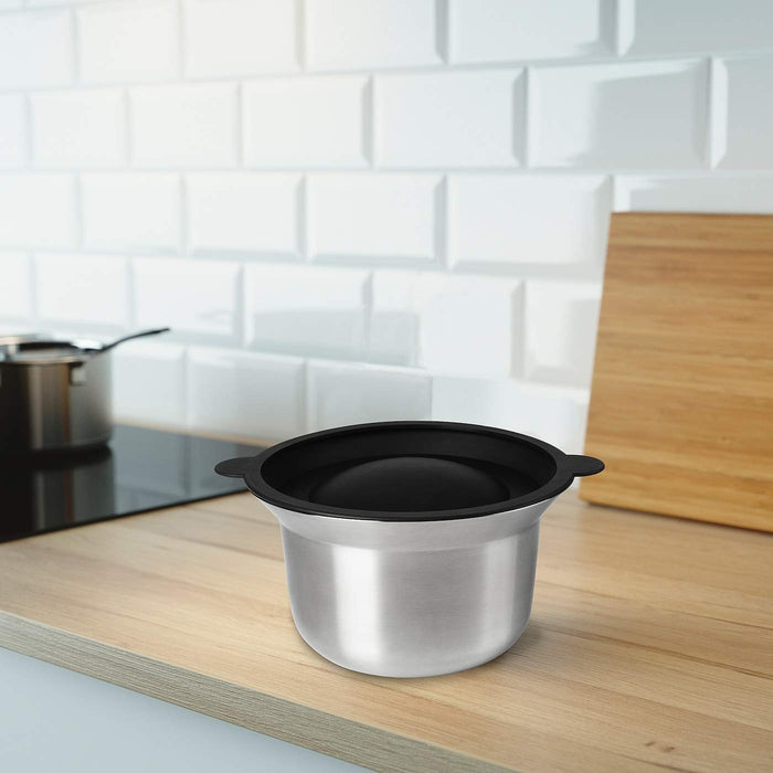 A image of a mixing bowl with a lid, highlighting its tapered shape and pour spout, from IKEA.