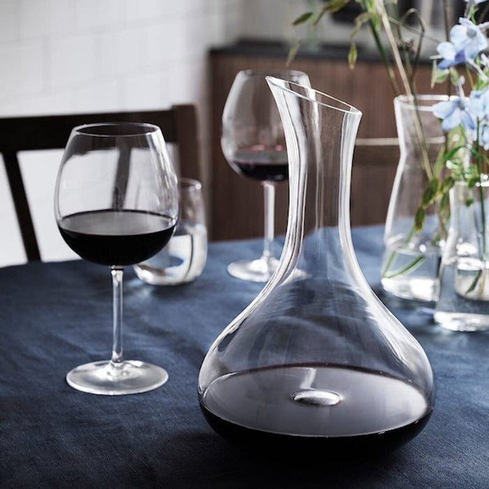 IKEA carafe is made of clear glass, perfect for serving drinks and beverages.
