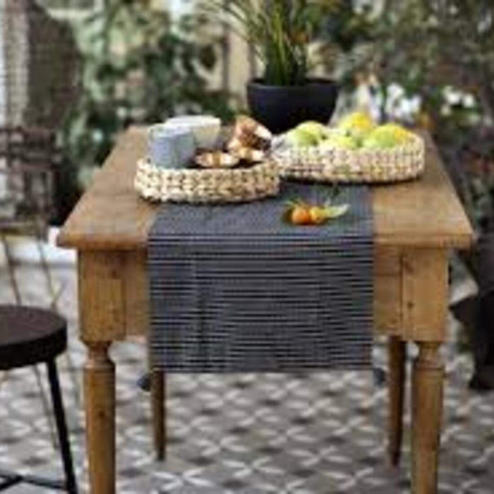 A contemporary table runner that complements modern decor. 00450903