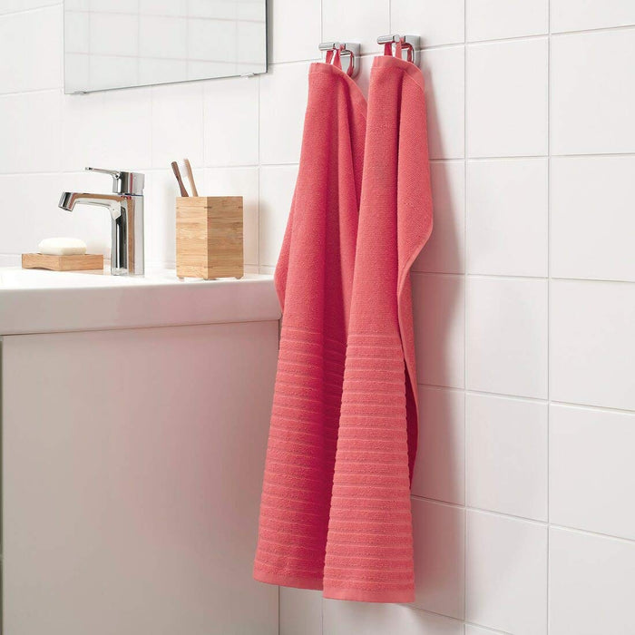 An image of an IKEA hand towel in a red and white striped pattern, adding a classic and timeless touch to any bathroom.00439430
