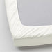A closeup image of IKEA sheet fits over the corners of your mattress and stays in place thanks to the elastic edging  60342722