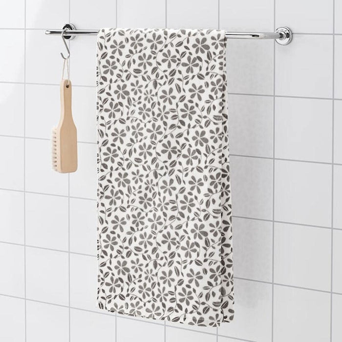 A soft and absorbent bath towel from IKEA, in a classic white and grey stripe design, perfect for drying off after a shower or bath. 404.555.93