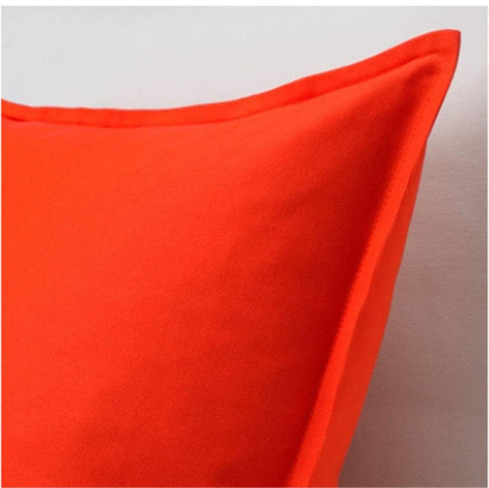 A close-up of an IKEA cushion cover in a textured orange fabric, featuring a subtle pattern of light and dark woven threads40431026