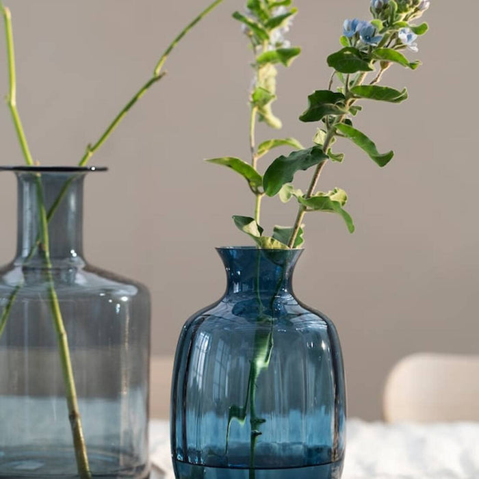 A modern blue plant vase for home decor with a minimalist look. 10442192