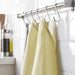A cotton towel with a loop at one end, suitable for hanging on a hook or bar for easy access 80473118