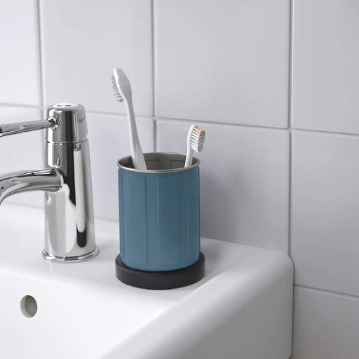 A modern toothbrush holder with a sleek design and multiple slots 70349493