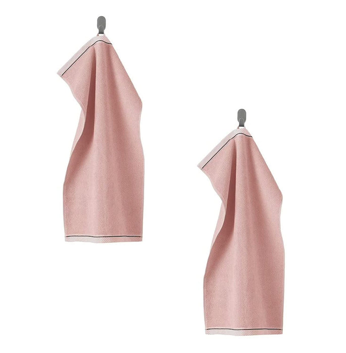 A pink hand towel with a soft, smooth texture 90475348