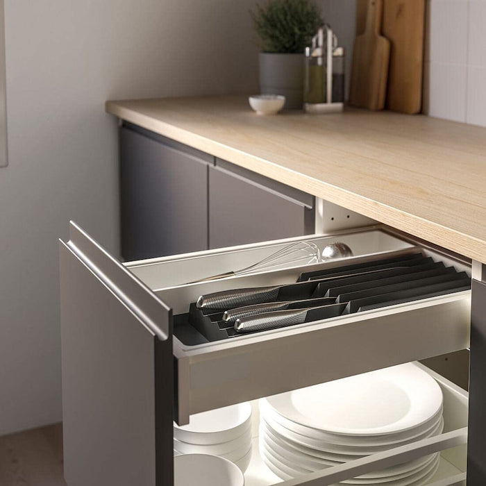 The IKEA tray and knife rack set in use, with various ingredients and utensils scattered on the counter.