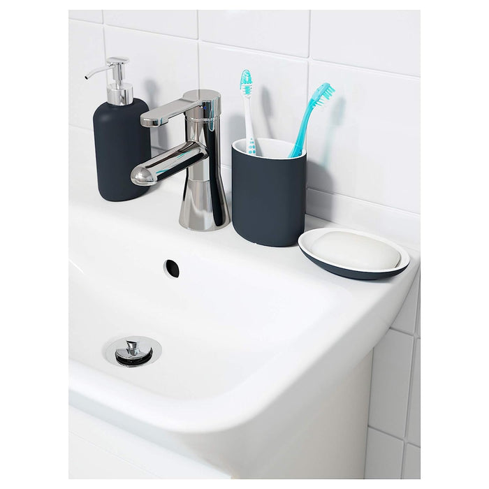Bathroom accessory set for small spaces: A set of four dark grey bathroom accessories including a toothbrush holder, soap dish, soap dispenser, and toilet brush, designed to fit in small bathrooms.