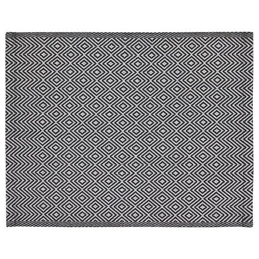 A woven placemat with a geometric pattern in shades of grey and white 50342869