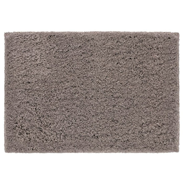 Beige bath mat from IKEA with plush texture and anti-slip backing for added safety and comfort 00489420