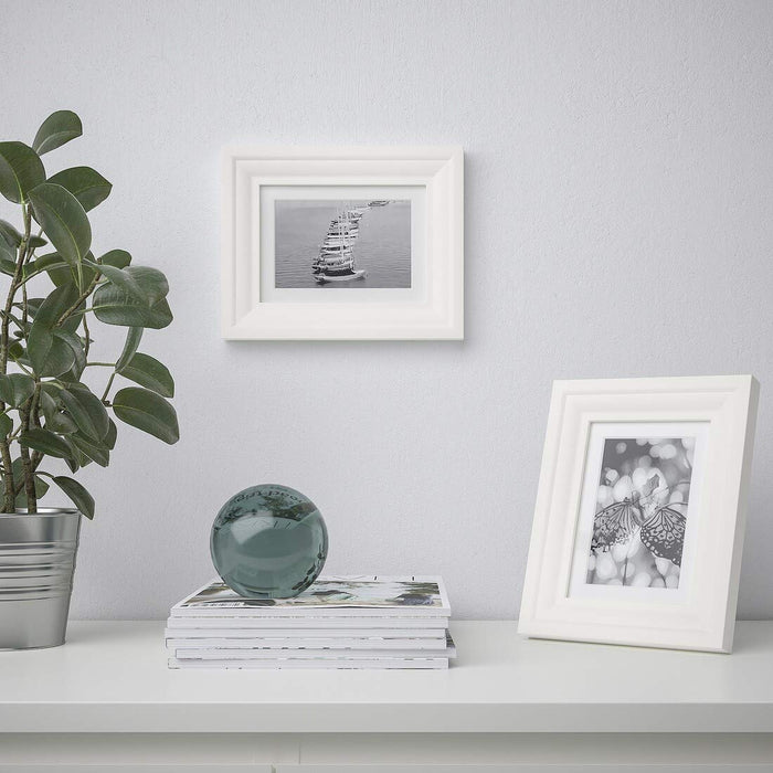 A collage photo frame that allows you to display multiple photos at once, creating a unique and personalized display 50427316