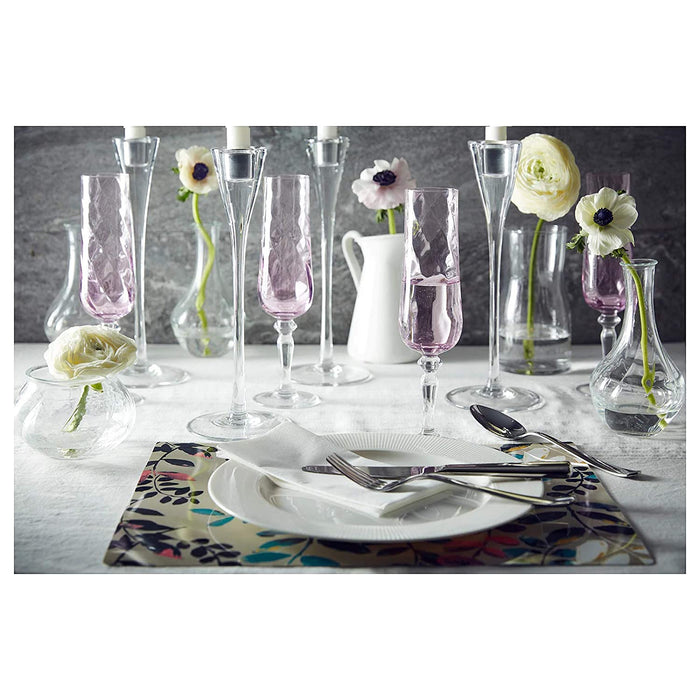  IKEA glass champagne flute, featuring a long, thin stem and a narrow, tall bowl that is perfect for sipping champagne or sparkling wine.