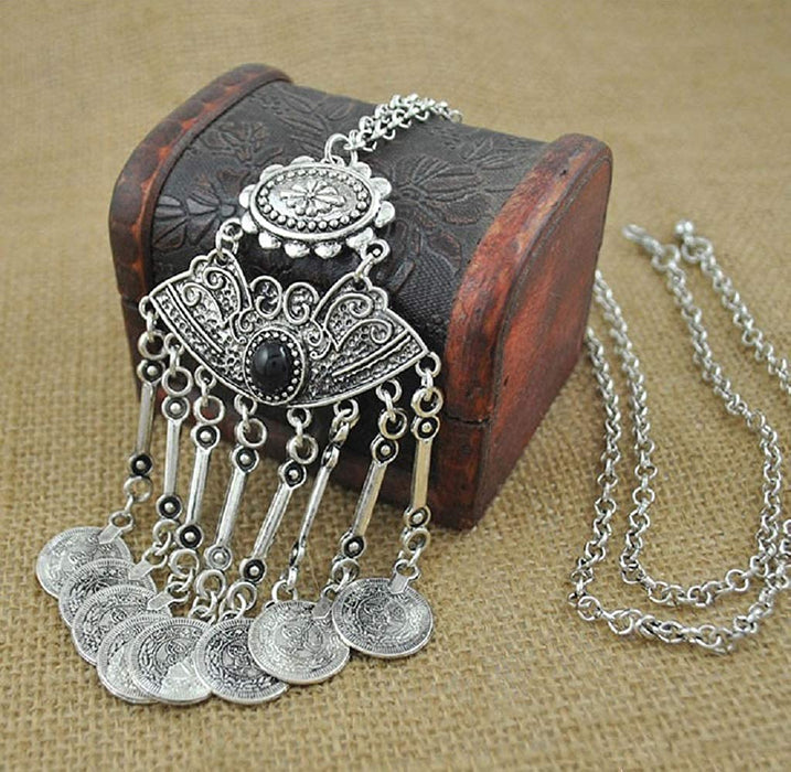 A vintage coin long chain necklace with intricate coin details and a bohemian style.