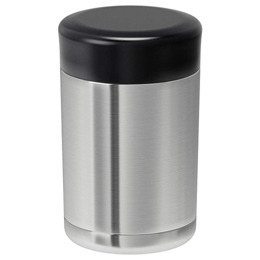 A stainless steel vacuum flask with a silver finish and a black cap, filled with hot coffee. 00288370