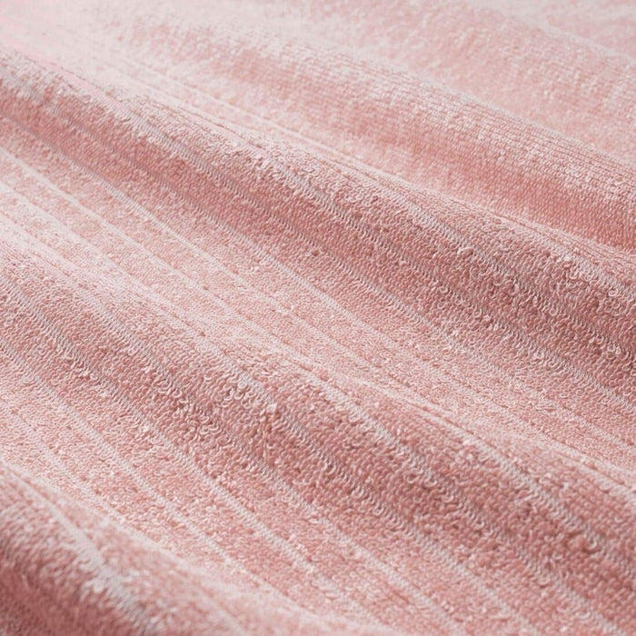 A close-up image of a pink IKEA hand towel folded neatly with a soft texture 70488016