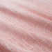 A close-up of the soft and fluffy texture of a pink towel from the Ikea 6 Piece Combo Set.