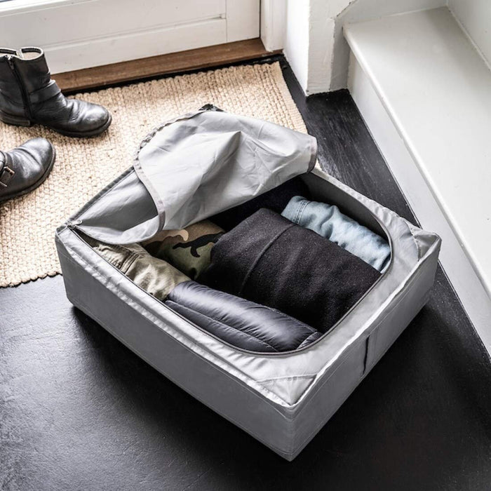 Grey storage case filled with neatly folded clothes 40472984
