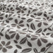 A close-up image of an IKEA hand towel in white/grey with a soft and absorbent surface 70455596