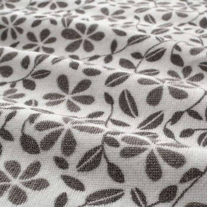 A close-up image of an IKEA hand towel in white/grey with a soft and absorbent surface 70455596