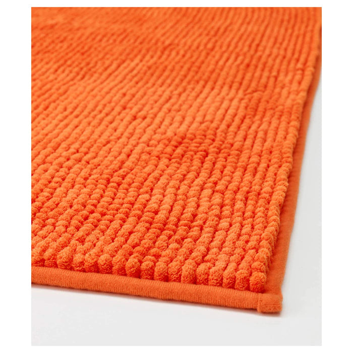 Thick and luxurious orange bath mat from IKEA, with a plush texture that provides comfort and warmth to your feet after a shower or bath 40242422