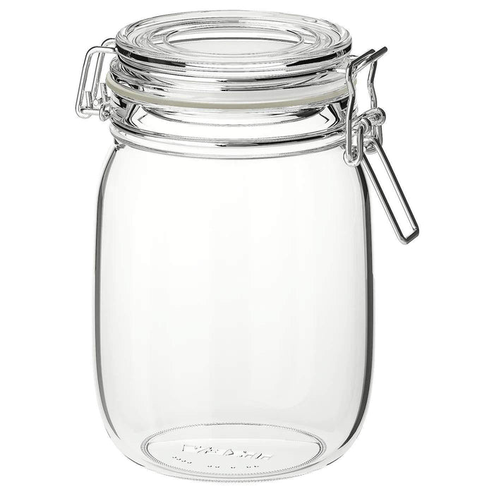 A transparent glass jar with a secure lid from IKEA, perfect for keeping items safe and visible.