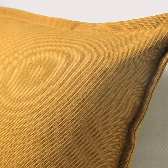 A close-up image of an IKEA cushion cover with a yellow plain pattern-00395822