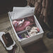 storage case filled with neatly folded clothes20309687