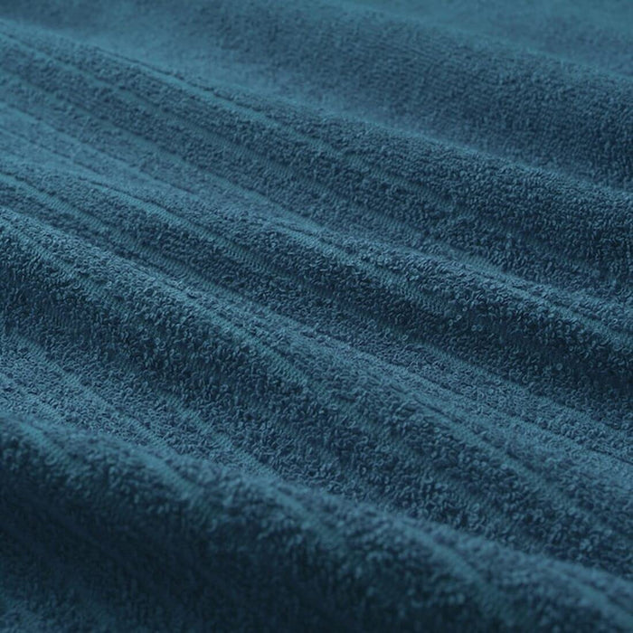 A close-up image of an IKEA hand towel in dark blue with a soft and absorbent surface 50488055