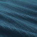 A close-up image of an IKEA hand towel in dark blue with a soft and absorbent surface 50488055