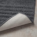 Thick and luxurious Dark grey bath mat from IKEA, with a plush texture that provides comfort and warmth to your feet after a shower or bath  10447279