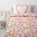 A cozy-looking bed with a colorful duvet cover and matching pillowcase from IKEA  50165833