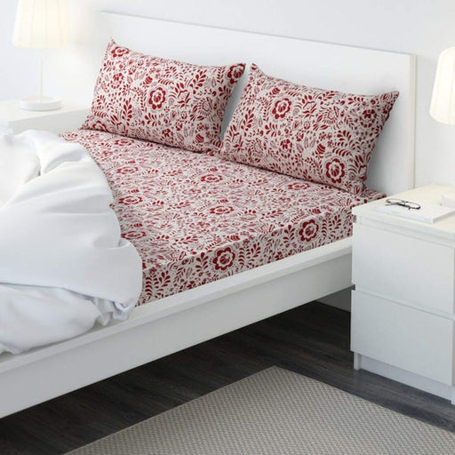 red cotton flat sheet and 2 pillowcase set from IKEA on a bed  40494293
